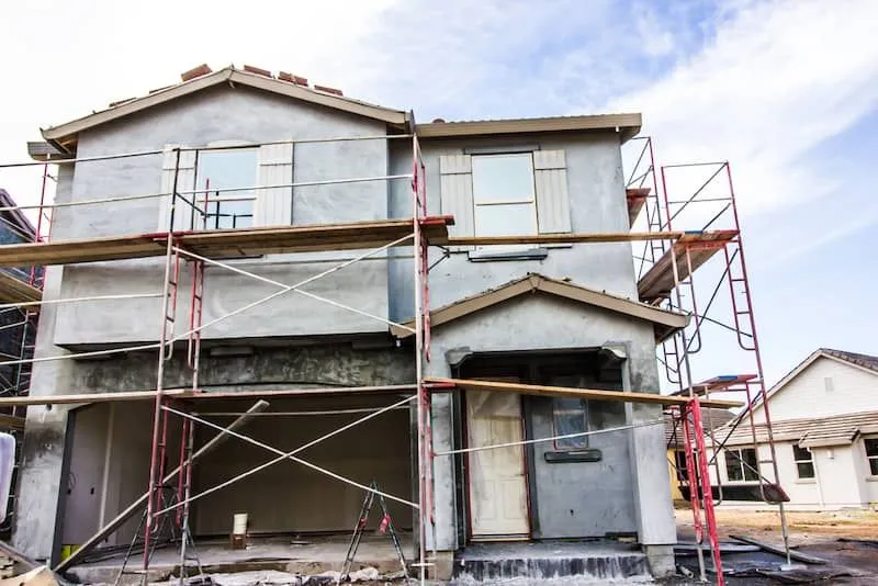 house under stucco construction house under stucco construction